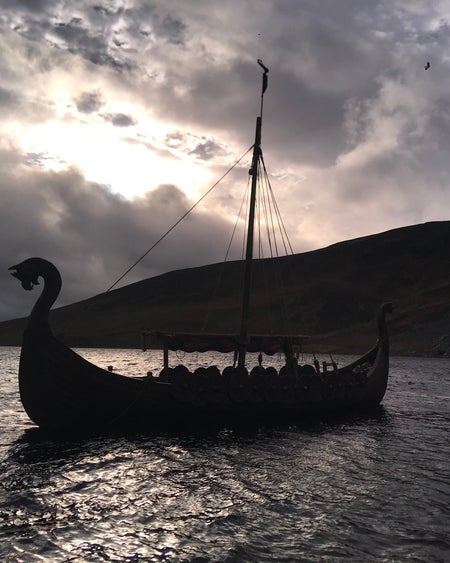 A Viking long boat on a dark evening