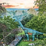 Jurassic Newpark aerial view of the park with a life size dinosaur model