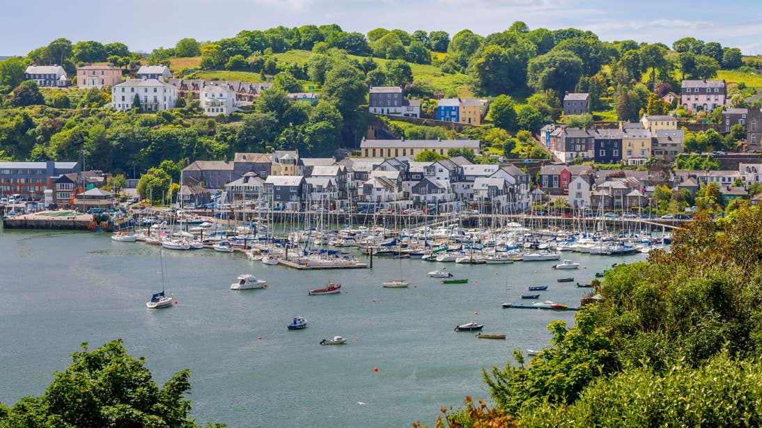 Boats in the water in front of houses in Kinsale Harbour in West Cork