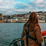 A couple looking out at Cobh in County Cork from a boat