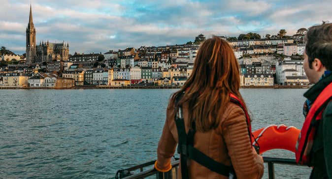 A couple looking out at Cobh in County Cork from a boat