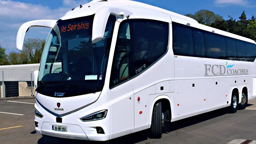 White FCD tour coach on the road