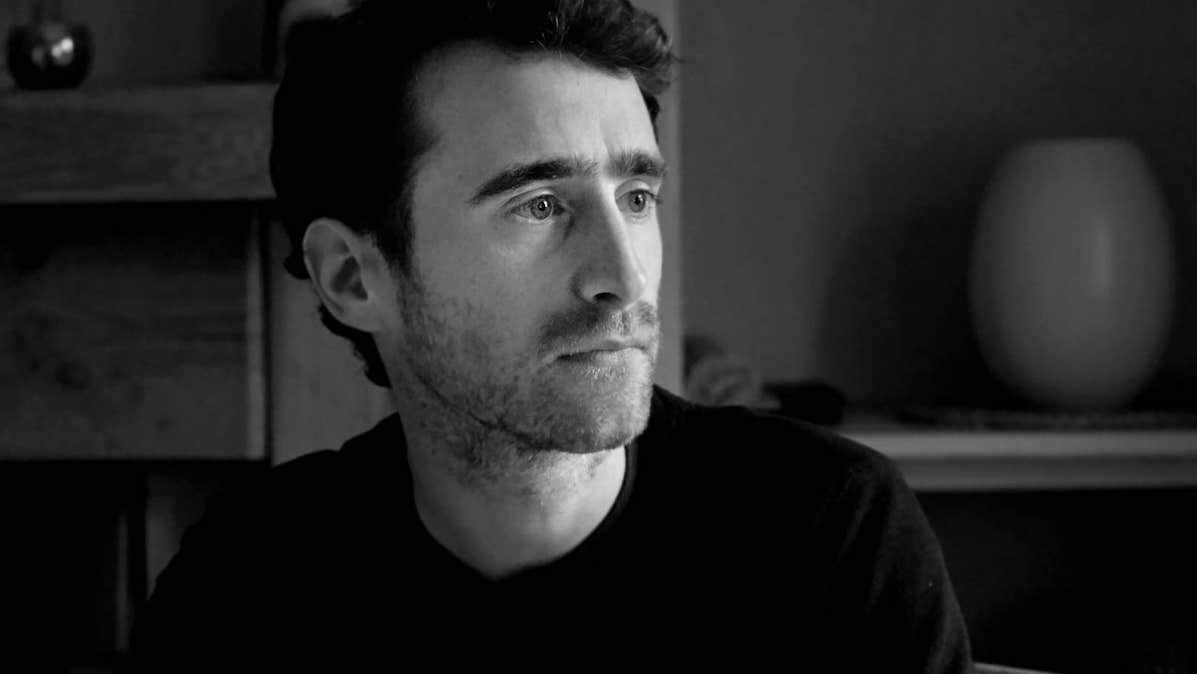 Tradition Now: Neil Ó Lochlainn’s Immram, black and white image of serious looking man, looking to his left