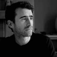 Tradition Now: Neil Ó Lochlainn’s Immram, black and white image of serious looking man, looking to his left