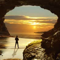 A man on Bundoran Beach in County Donegal at sunset