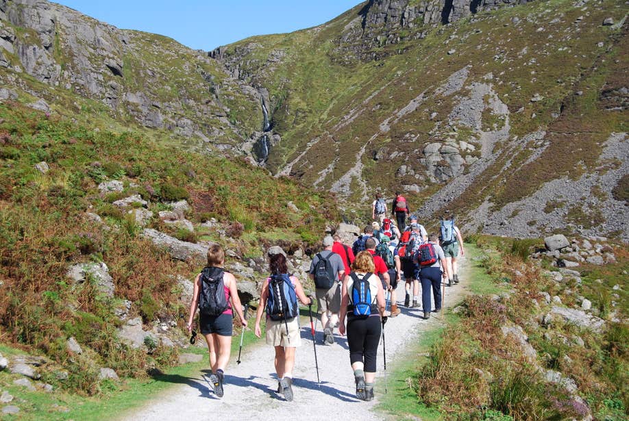 A group of hikers ascending the Comeragh Mountains in Waterford.