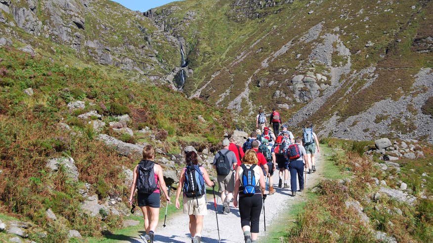 A group of hikers ascending the Comeragh Mountains in Waterford.