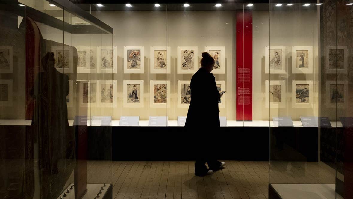visitor exploring 'A Dubliner’s Collection of Asian Art: The Albert Bender Collection'
