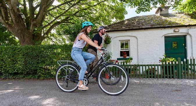 Couple cycling along the Royal Canal Greenway.