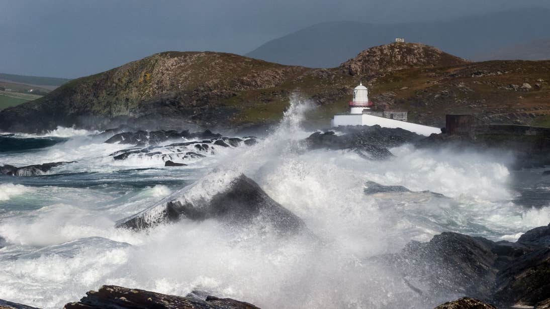 Waves crashing against rocks at Valentia Island Lighthouse, Kerry