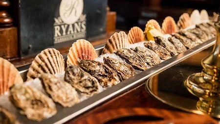 An arrangement of seashells and seafood