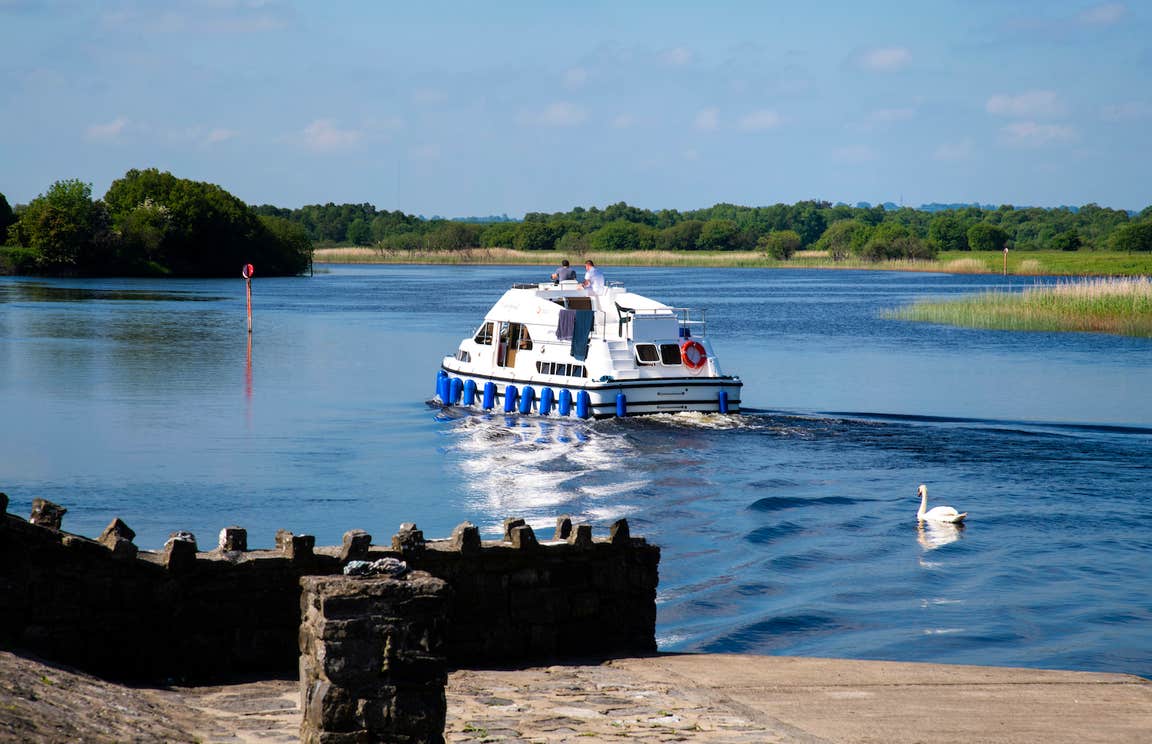 People on a river cruiser on the River Shannon.