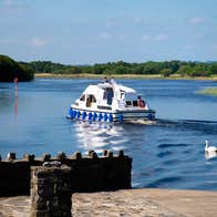 People on a river cruiser on the River Shannon.