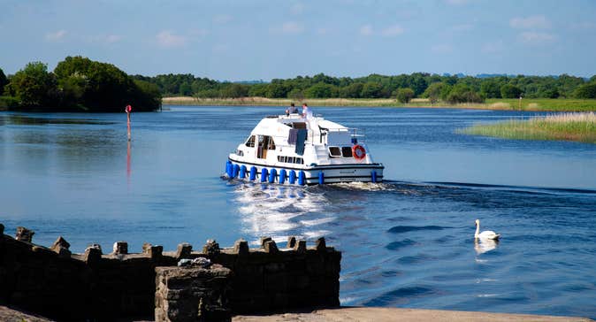 People on a river cruiser on the River Shannon.