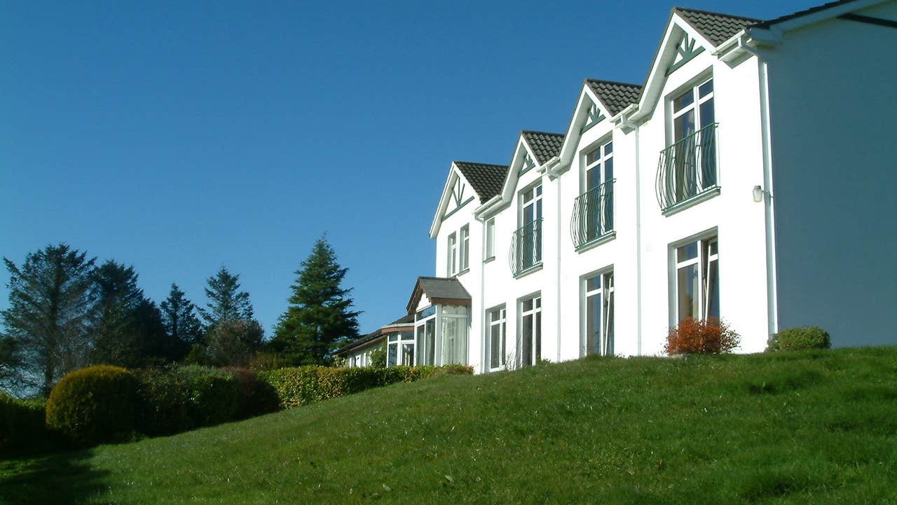 Side view of house and garden