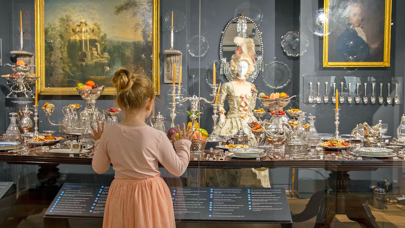 Irish Silver Museum view of a girl looking at ornate silver items in a display