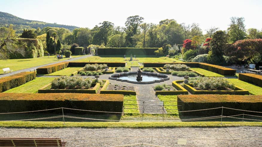 Beautiful gardens with shrubs, trees and a water feature at Killruddery House and Gardens