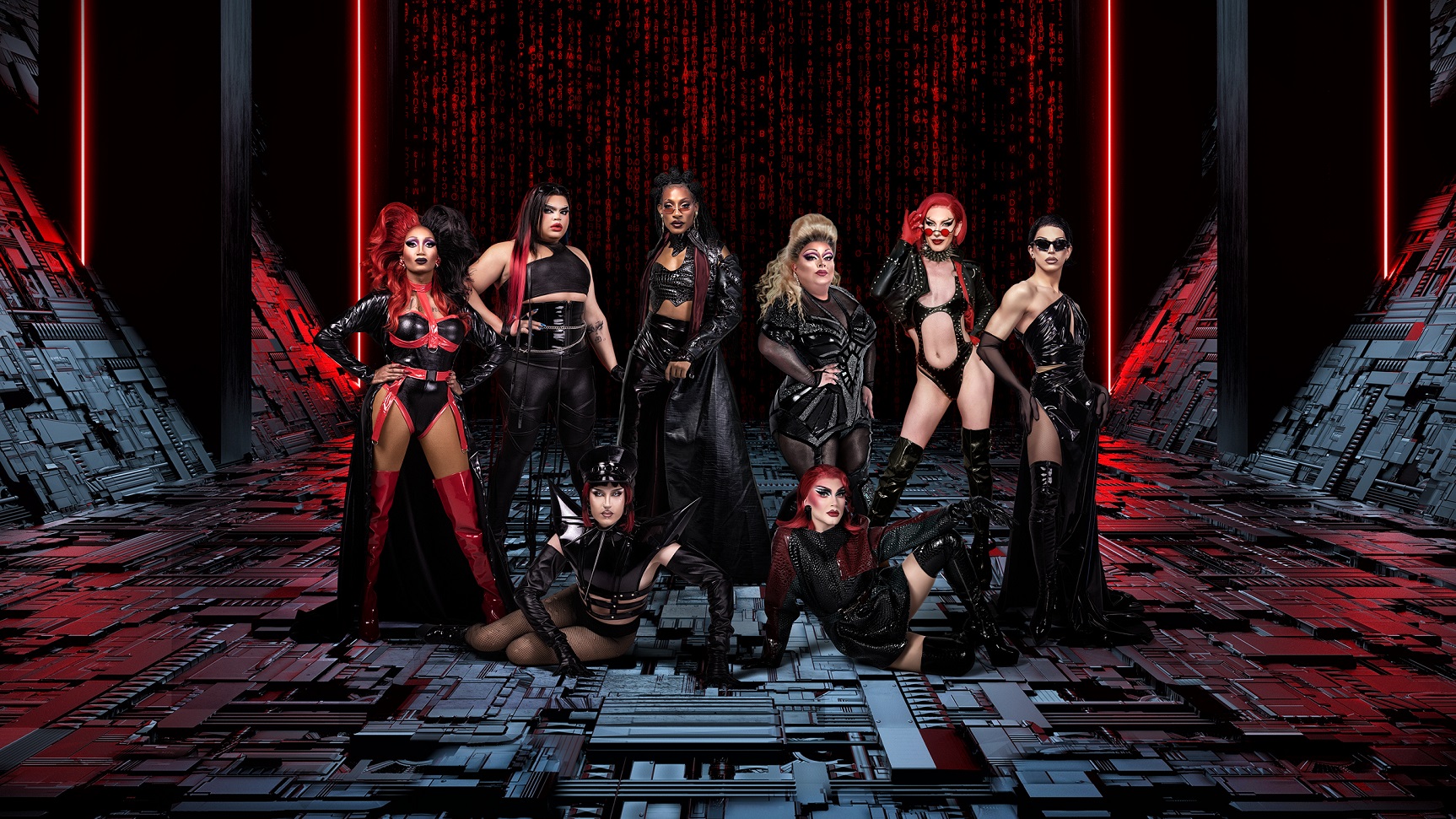The Queens from RuPaul's Drag Race Werq The World. Group all dressed in various black outfits with red on futuristic style set with dark grey floor with red lighting and dark background.