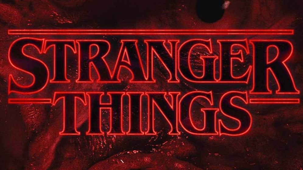 Large red title letters against swirly dark black and red background.