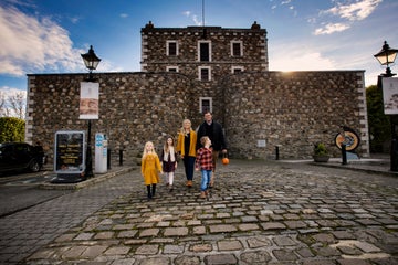 Image of a family outside Wicklow Gaol in County Wicklow