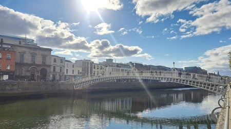 Bridge over a river and a blue sky with clouds