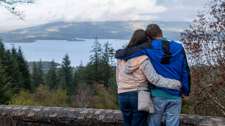 Couple looking out on view of water along the Leitrim Way.