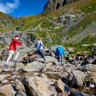 People hiking Mahon Falls in Co Waterford