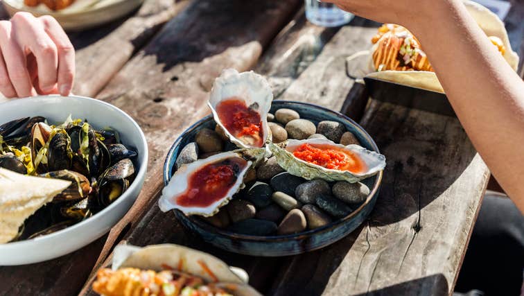 Picnic table full of seafood.