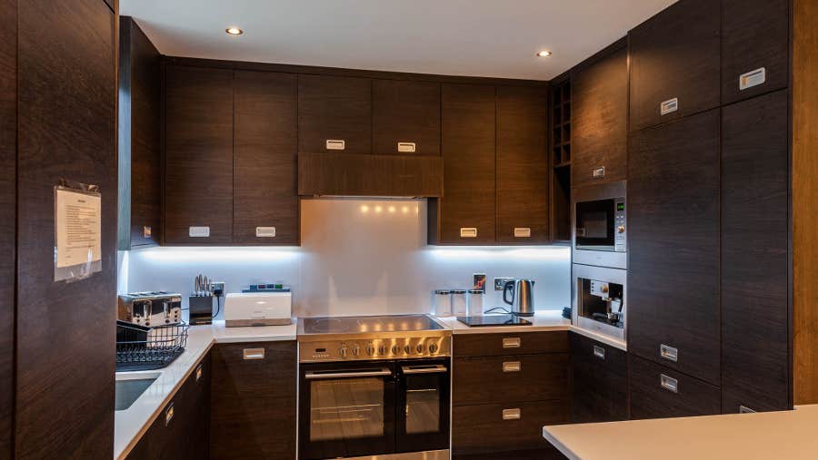 Kitchen with oven, hob and sick