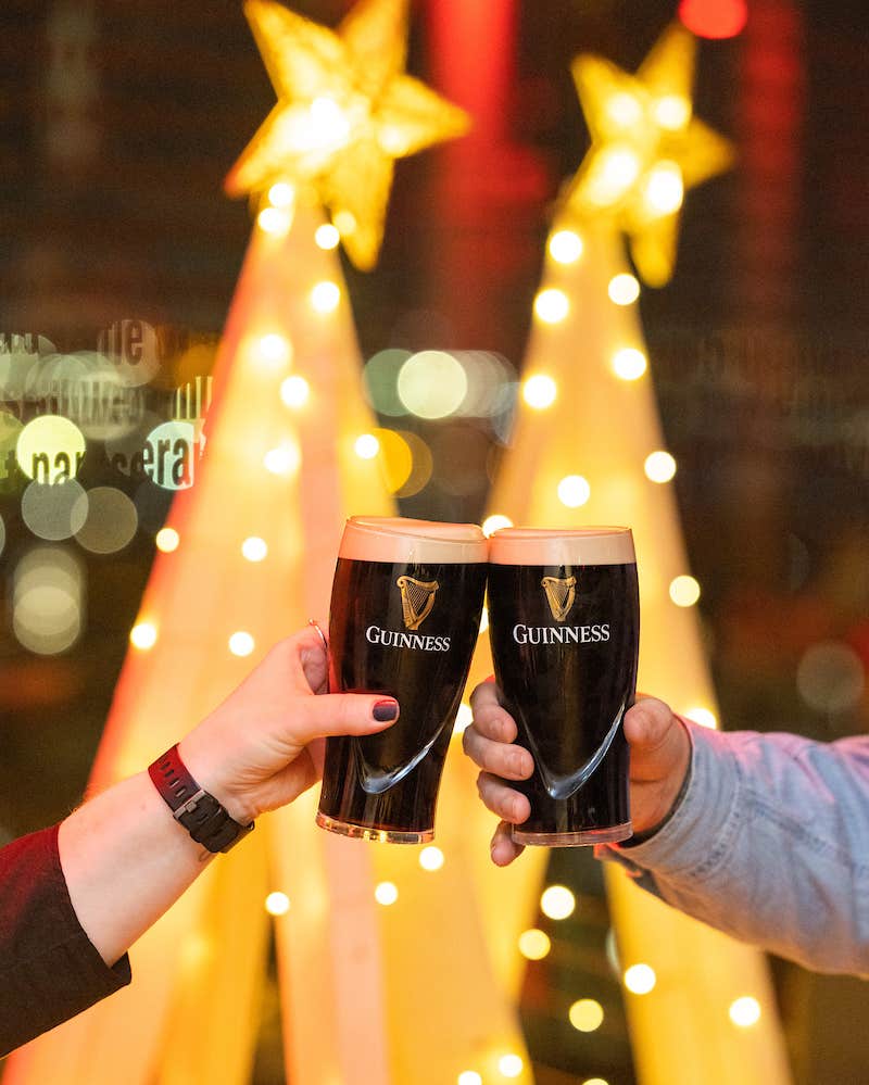 Clinking pints at the Guinness Storehouse at Christmas.