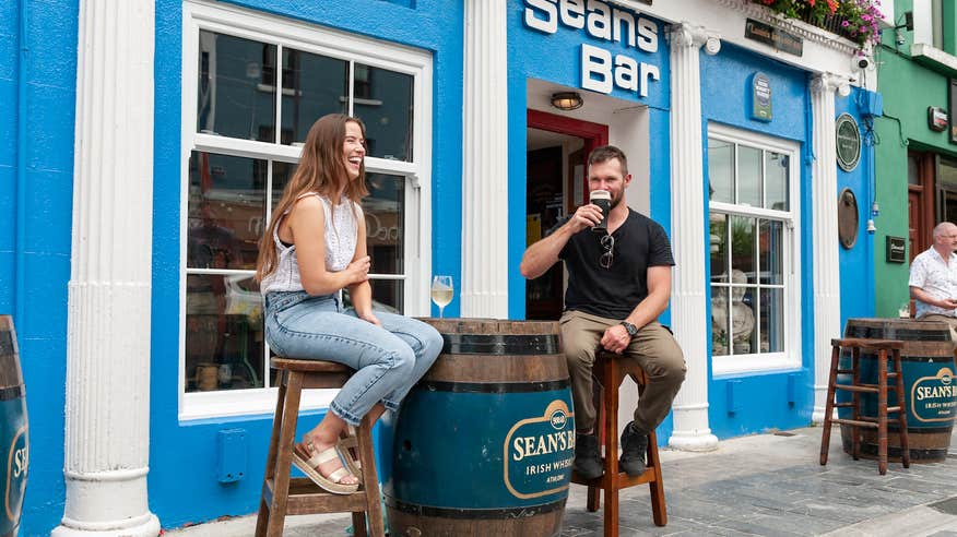 People sitting outside Sean's Bar in Athlone, Co Westmeath