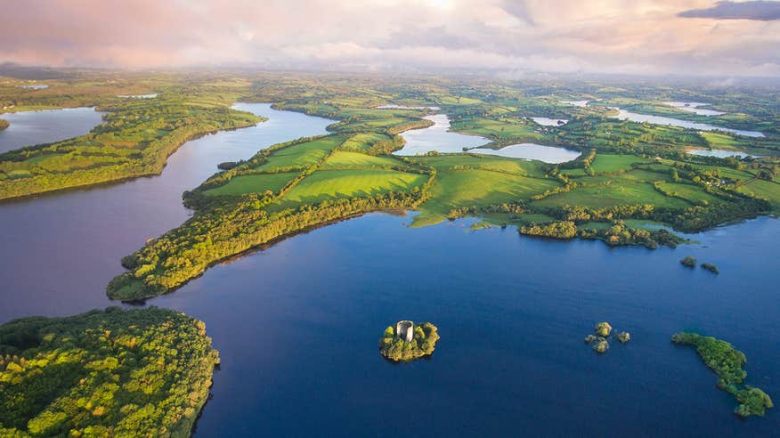 Clough Oughter Castle surrounded by water in the middle of a lake in County Cavan