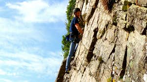 Image of man rock climbing