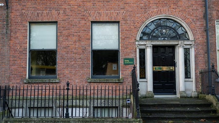 A red bricked exterior of a Georgian town house on a city street
