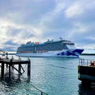 Cruise ship at sea close to shore line