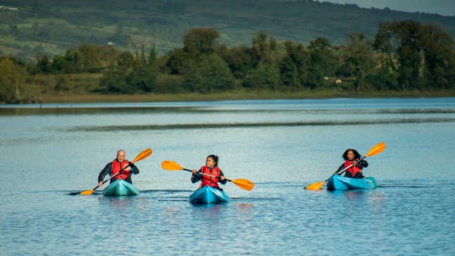 Three people kayaking in Lough Allen in Drumshambo, County Leitrim