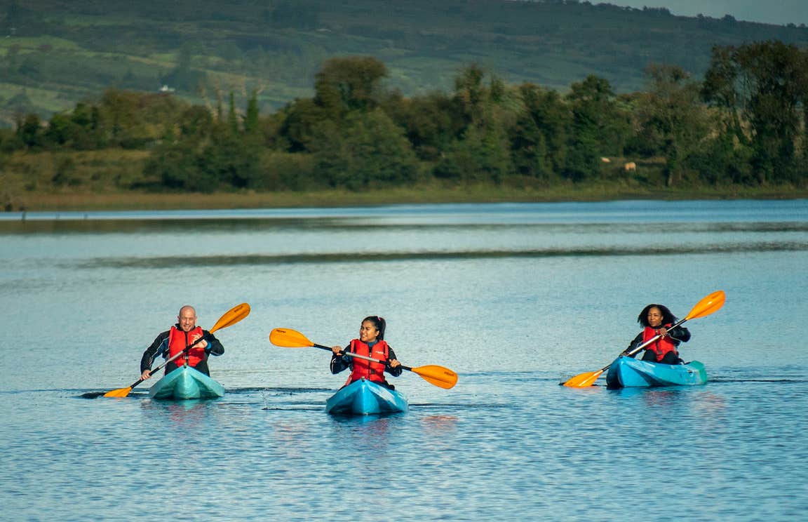Three people kayaking in Lough Allen in Drumshambo, County Leitrim