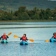 Three people kayaking in Lough Allen in Drumshambo, County Leitrim