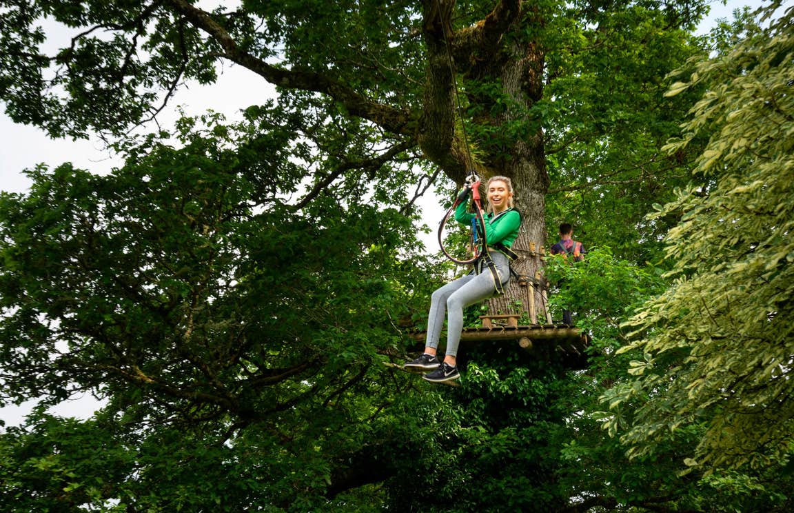Girl using a zipline at Lough Key Forest and Activity Park