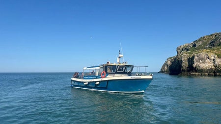 One of Howth Cliff Cruises boats out on a cruise