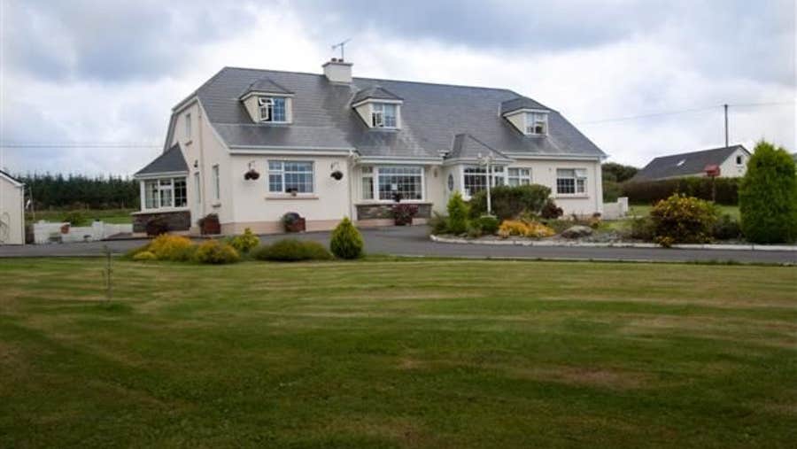 Exterior of house on mature garden