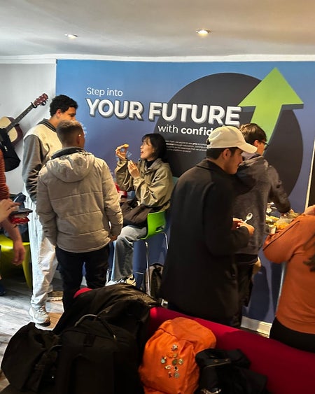 Students standing around talking in groups