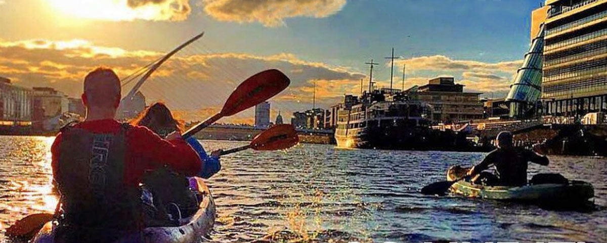 City Kayaking on the Liffey River in Dublin at sunset