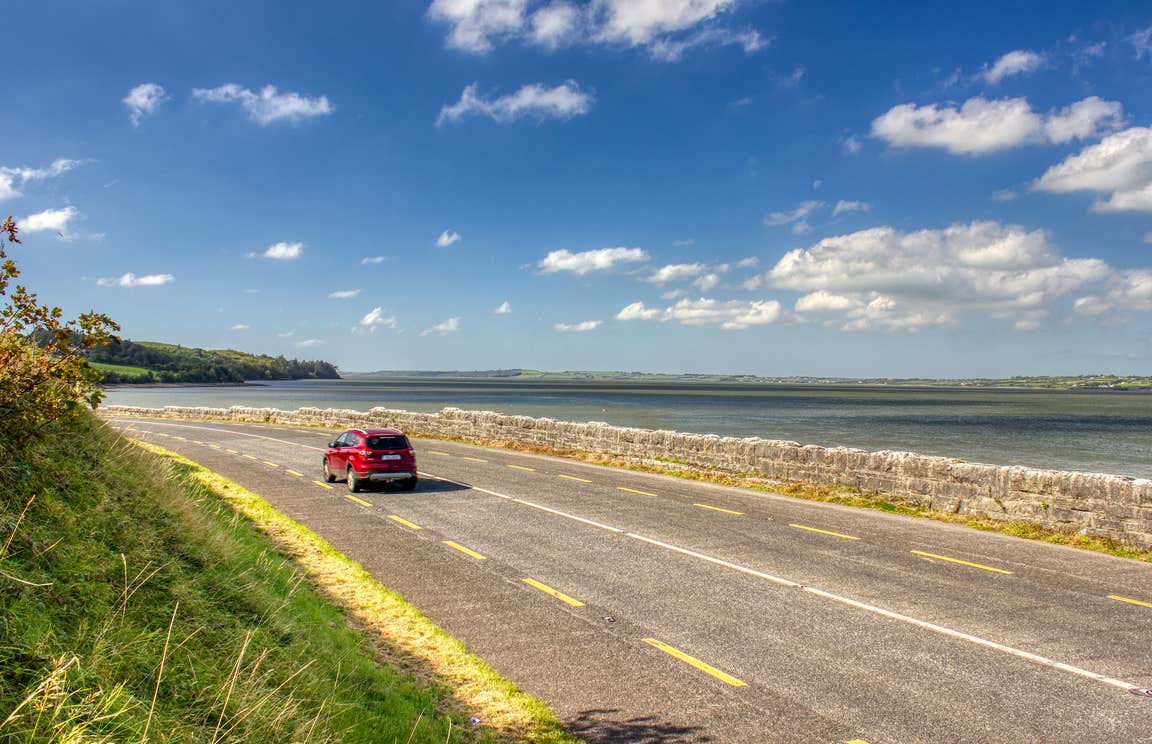 A car driving the Shannon Estuary Way in County Limerick