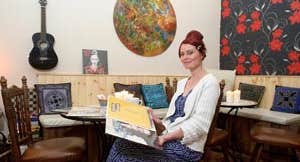 Image of lady in cafe - John Kelly Clare Champion