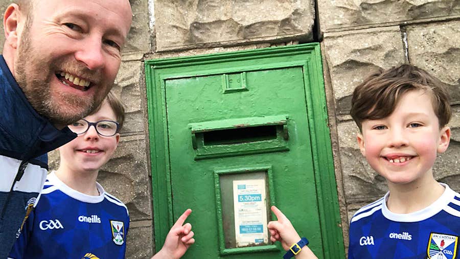 Scavenger Hunting Ireland family pointing to a postbox