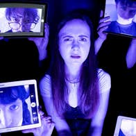 Poster for the production with central image of a woman looking very confused surrounded by hands holding up 4 different screens with mens faces on, all in shades of black and purple