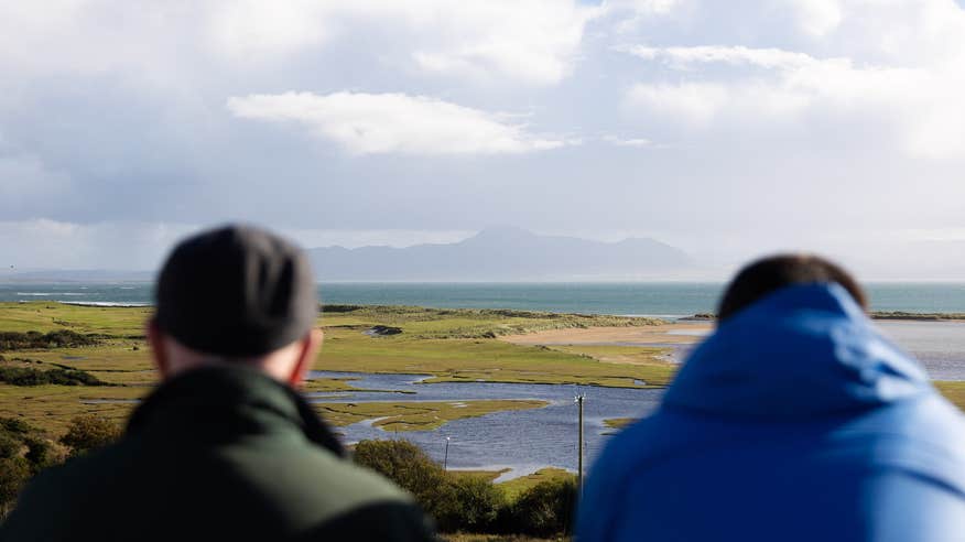 Two men in Mulranny village looking out over Clew Bay in Co Mayo