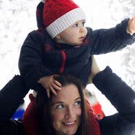 Wonderlights at Malahide Castle - a baby on the shoulders of an adult looking with wonder a white lights