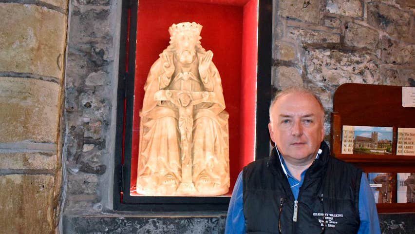Pat your guide in the Black Abbey standing in front of an alabaster statue of the Holy Trinity